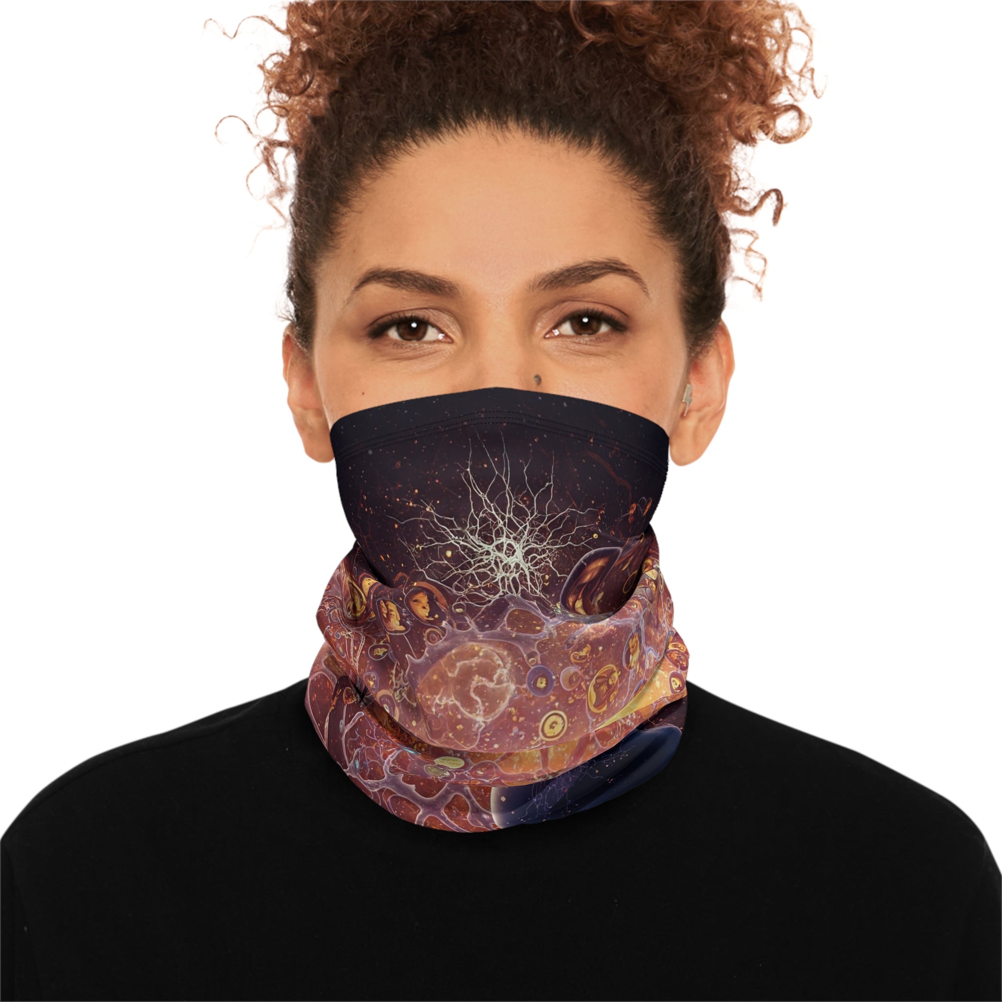 Person wearing a colorful patterned face mask on a white background