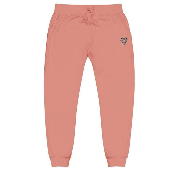 Pink sweatpants with a heart design on a white background